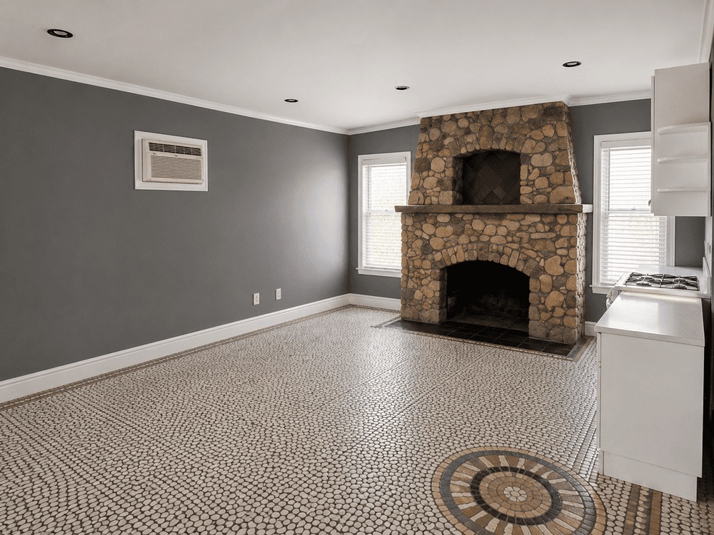 Living space and stone fireplace at 159 Ocean Avenue